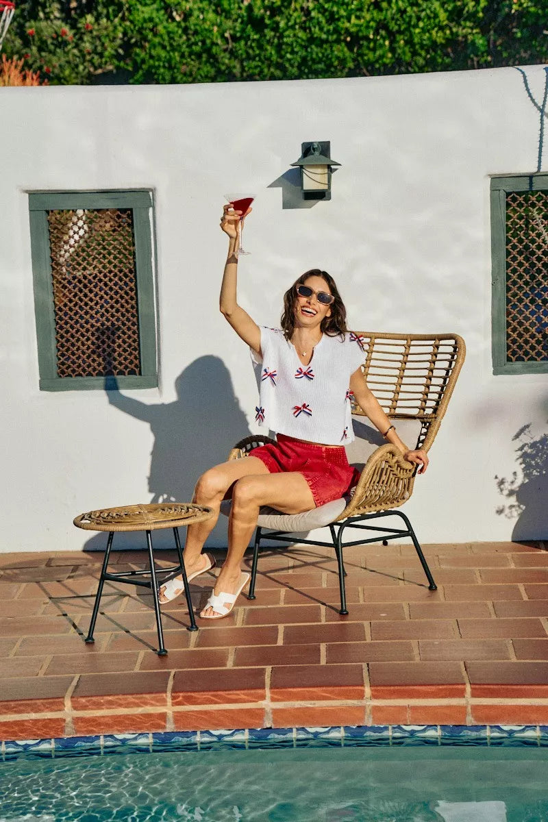 Side view of the OFF WHITE SO ME 4th Of July Ribbon Trimmed Dolman Sweater Top, styled with polished boutique styling for day-to-night outfits, made for women who want easy layering.
