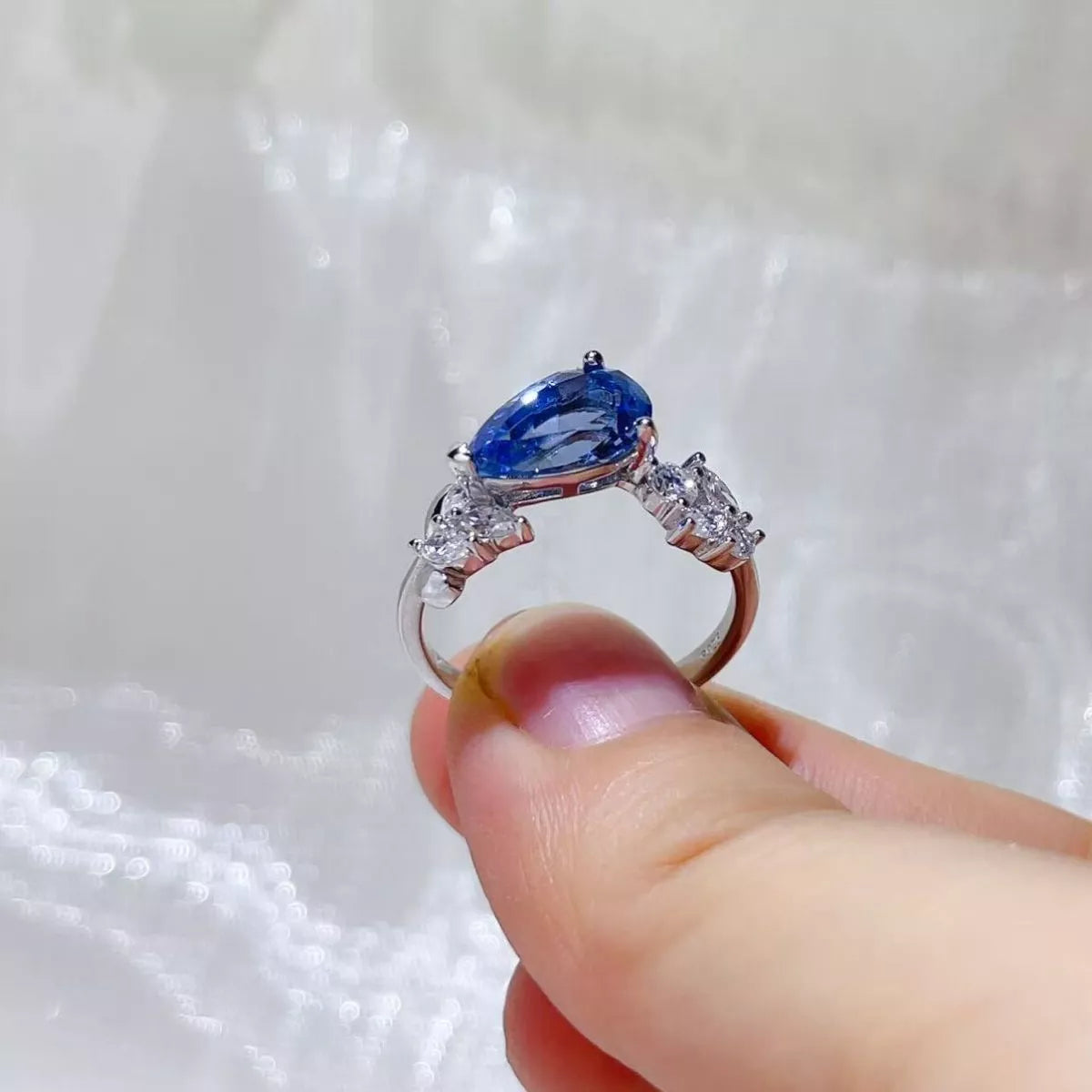 Side view of the Royal Blue 3 Carat Moissanite 925 Sterling Silver Ring, styled with delicate sparkle for daily wear and gifting, made for women who want refined jewelry.