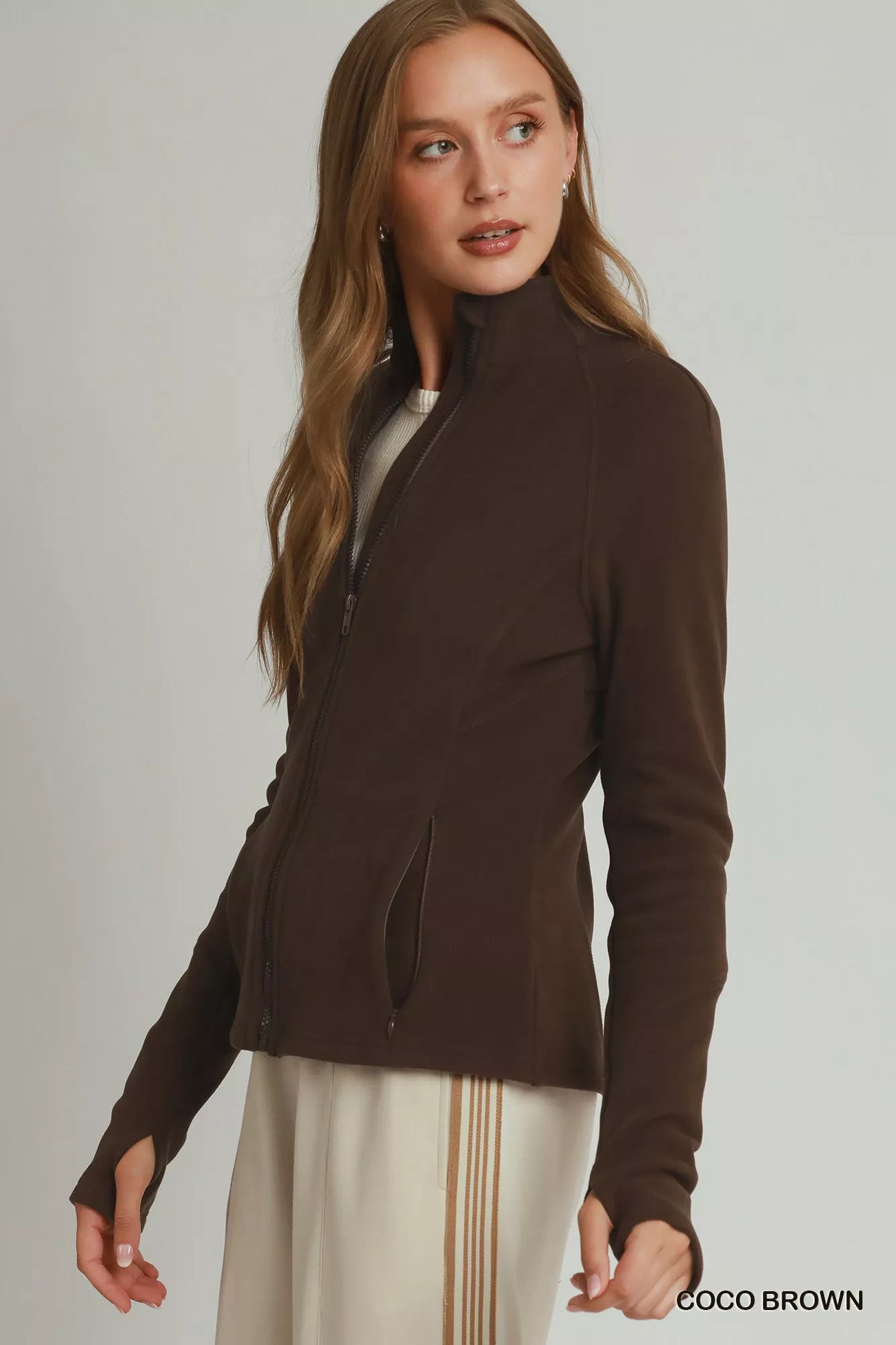 Side view of the COCO BROWN Umgee Soft Fleece Full Zip Jacket With Pockets, styled with polished boutique styling for day-to-night outfits, made for women who want easy layering.