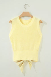 Neckline detail of the Light Yellow Solid Color Cropped Knit Knot Back Cutout Sweater Tank, styled with polished boutique styling for day-to-night outfits, made for women who want easy layering.