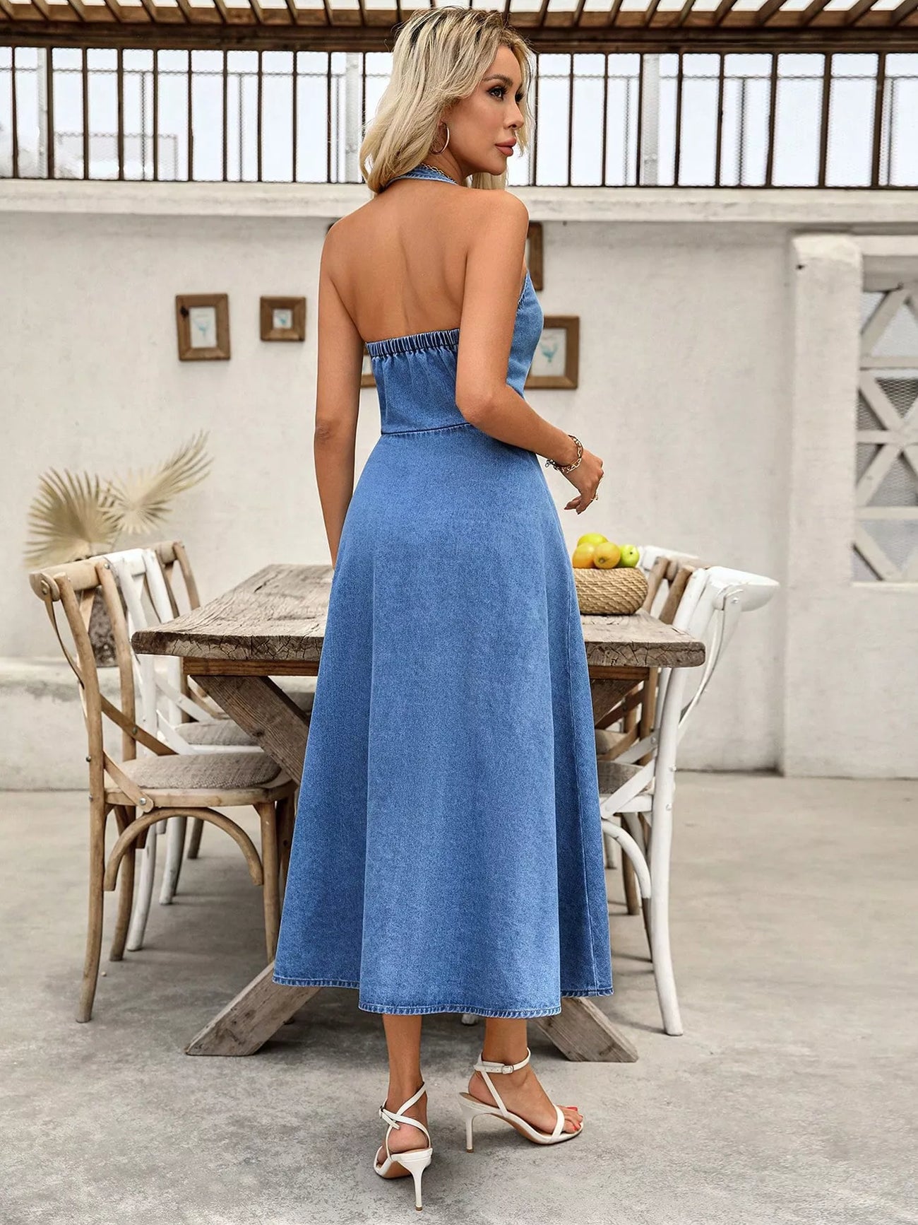 Full-length view of the Light Halter Neck Button-Down Denim Dress, styled with feminine boutique styling for dinners, travel, and events, made for women who want elegant styling.