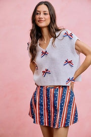 Styled outfit view of the OFF WHITE SO ME 4th Of July Ribbon Trimmed Dolman Sweater Top, styled with polished boutique styling for day-to-night outfits, made for women who want easy layering.