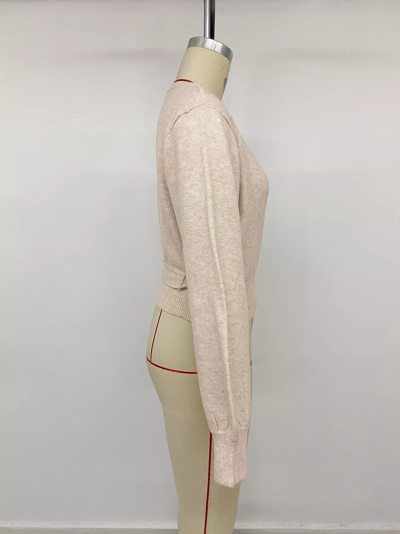 Fabric detail of the Apricot Tied Surplice Long Sleeve Sweater, styled with polished boutique styling for day-to-night outfits, made for women who want easy layering.