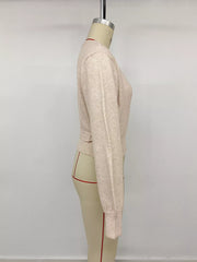 Fabric detail of the Apricot Tied Surplice Long Sleeve Sweater, styled with polished boutique styling for day-to-night outfits, made for women who want easy layering.