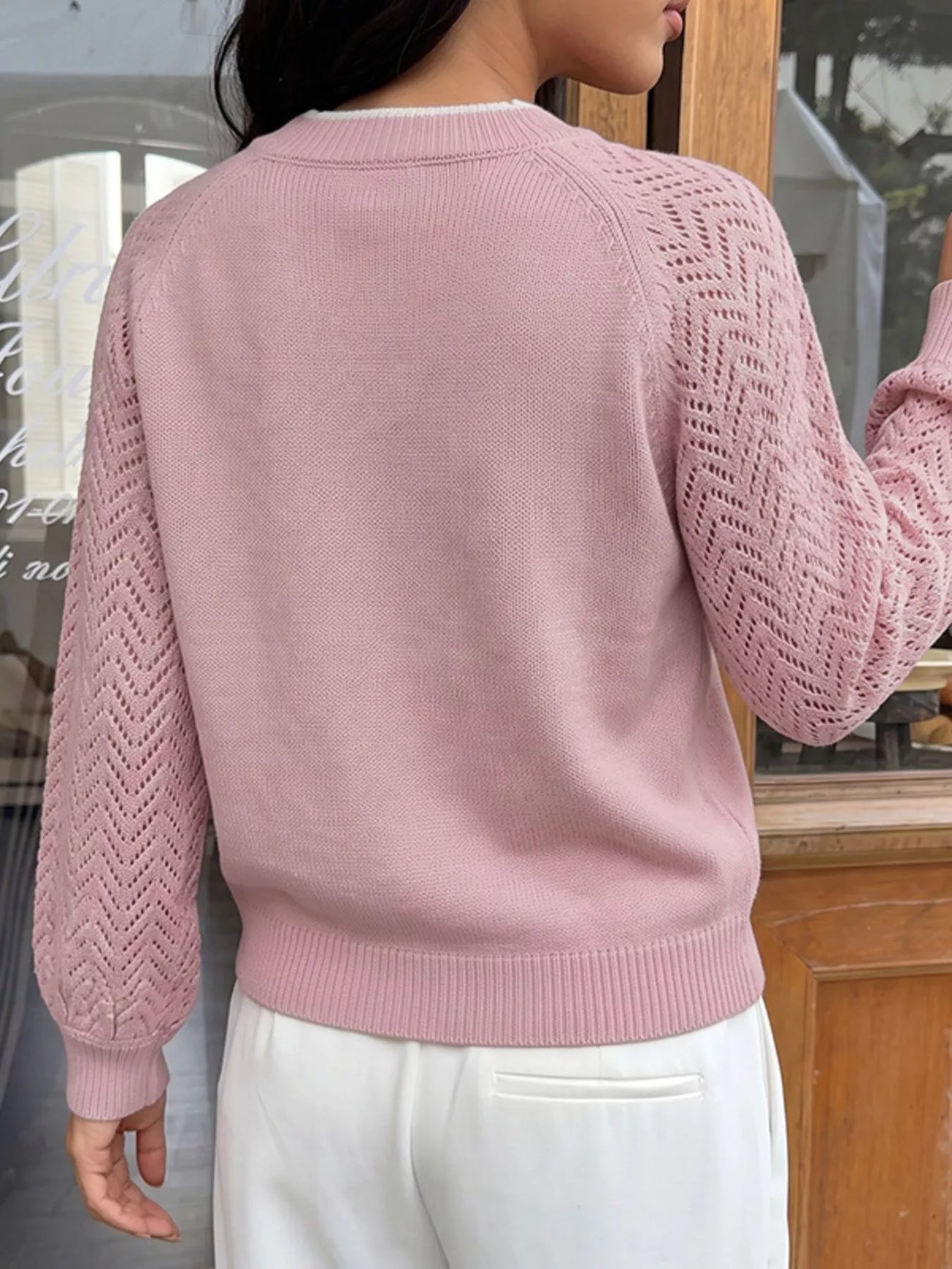 Fabric detail of the Pink V-Neck Openwork Long Sleeve Sweater, styled with polished boutique styling for day-to-night outfits, made for women who want easy layering.